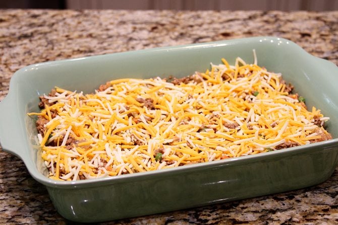 This Cheesy Beef Bake with Onion Rings is a delicious twist on the Classic Tater Tot Casserole!