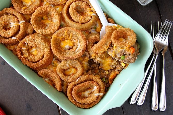 This Cheesy Beef Bake with Onion Rings is a delicious twist on the Classic Tater Tot Casserole!