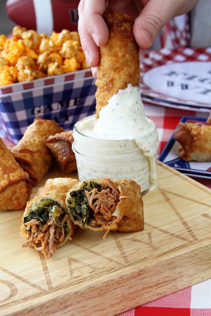 These Pulled Pork and Collard Green Egg Rolls with Alabama White BBQ Dipping Sauce combine so many things that are great about southern food!