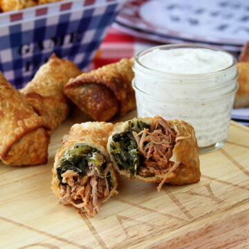These Pulled Pork and Collard Green Egg Rolls with Alabama White BBQ Dipping Sauce combine so many things that are great about southern food!