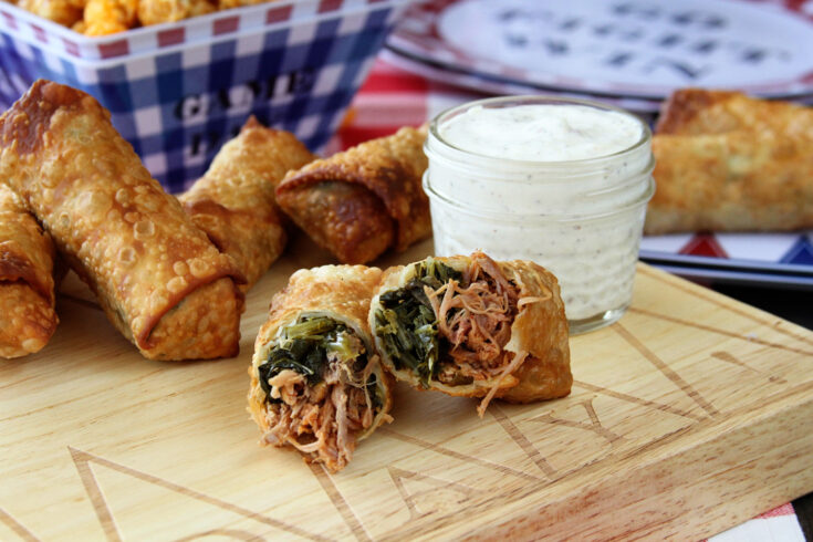 These Pulled Pork and Collard Green Egg Rolls with Alabama White BBQ Dipping Sauce combine so many things that are great about southern food!