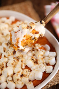 Scoop of Big Mama's Sweet Potato Pudding with melted marshmallows