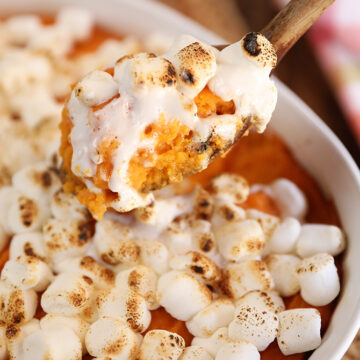Scoop of Big Mama's Sweet Potato Pudding with melted marshmallows