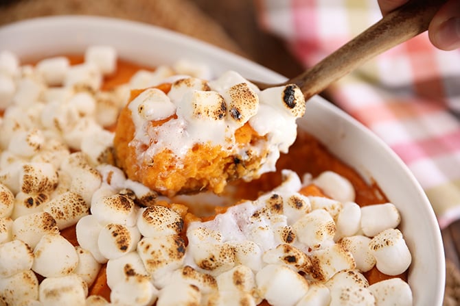 Scoop of Big Mama's Sweet Potato Pudding with melted marshmallows