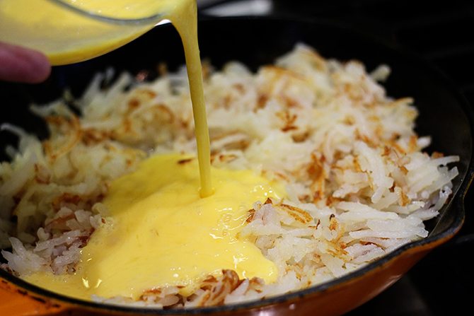 Hash browns, eggs, spinach, and chicken bacon combine to make this lightened-up version of a breakfast classic!