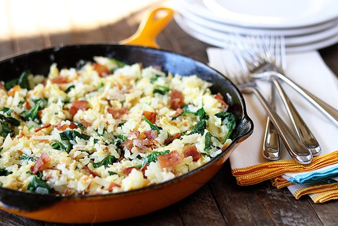 Hash browns, eggs, spinach, and chicken bacon combine to make this lightened-up version of a breakfast classic!