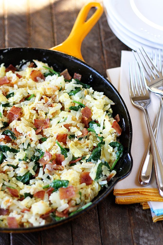 Hash browns, eggs, spinach, and chicken bacon combine to make this lightened-up version of a breakfast classic!