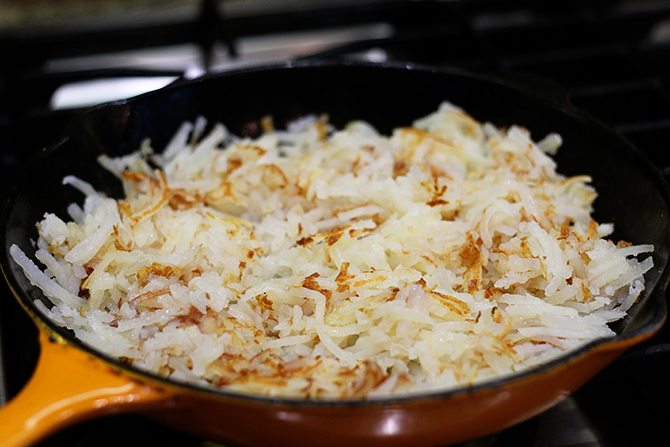 Hash browns, eggs, spinach, and chicken bacon combine to make this lightened-up version of a breakfast classic!