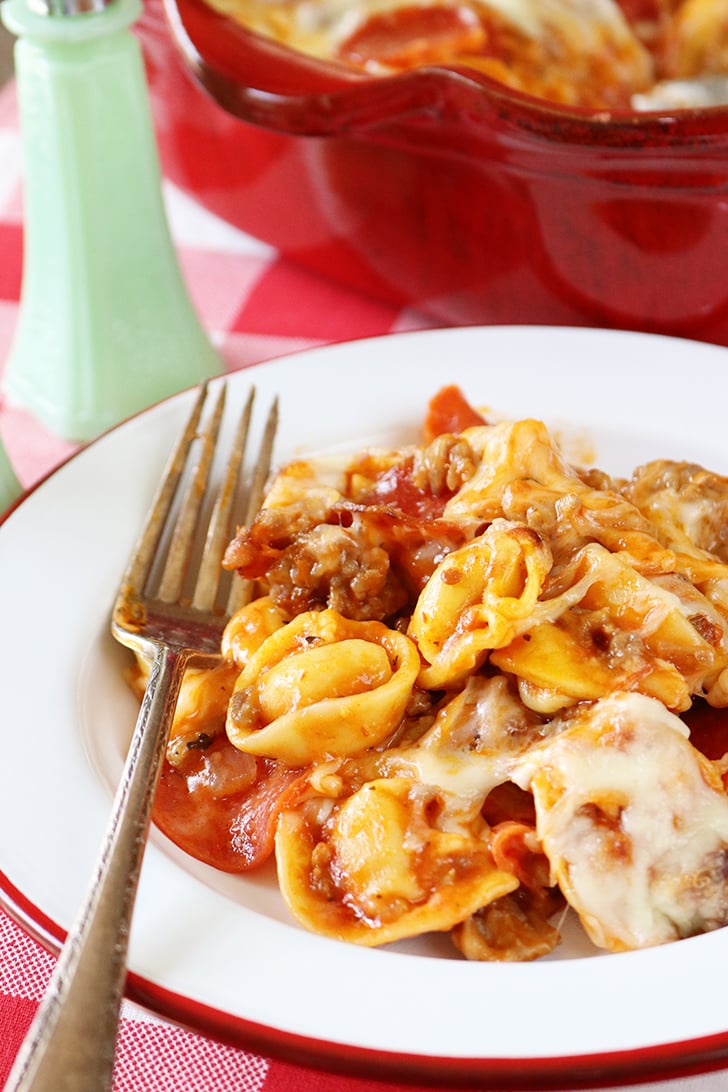 Baked Pizza Tortellini in a white bowl.