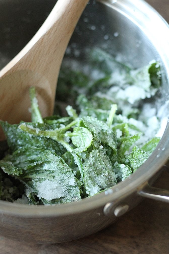 basil and sugar in a pot.