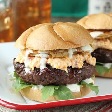 Put a little South in your mouth with this burger topped with pimiento cheese, fried green tomatoes, and Alabama White BBQ Sauce!