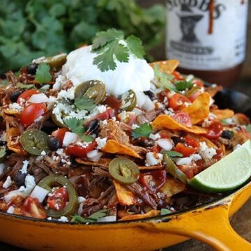 The Slow Cooker does all the hard work with these amazingly delicious LOADED Brisket Nachos!