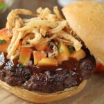 Top this sweet and sticky pork burger with homemade peach salsa for an unexpected kick!