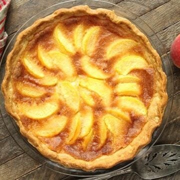 This Peach Chess Pie combines all the flavor of delicious peach cobbler in a decadent custard pie!