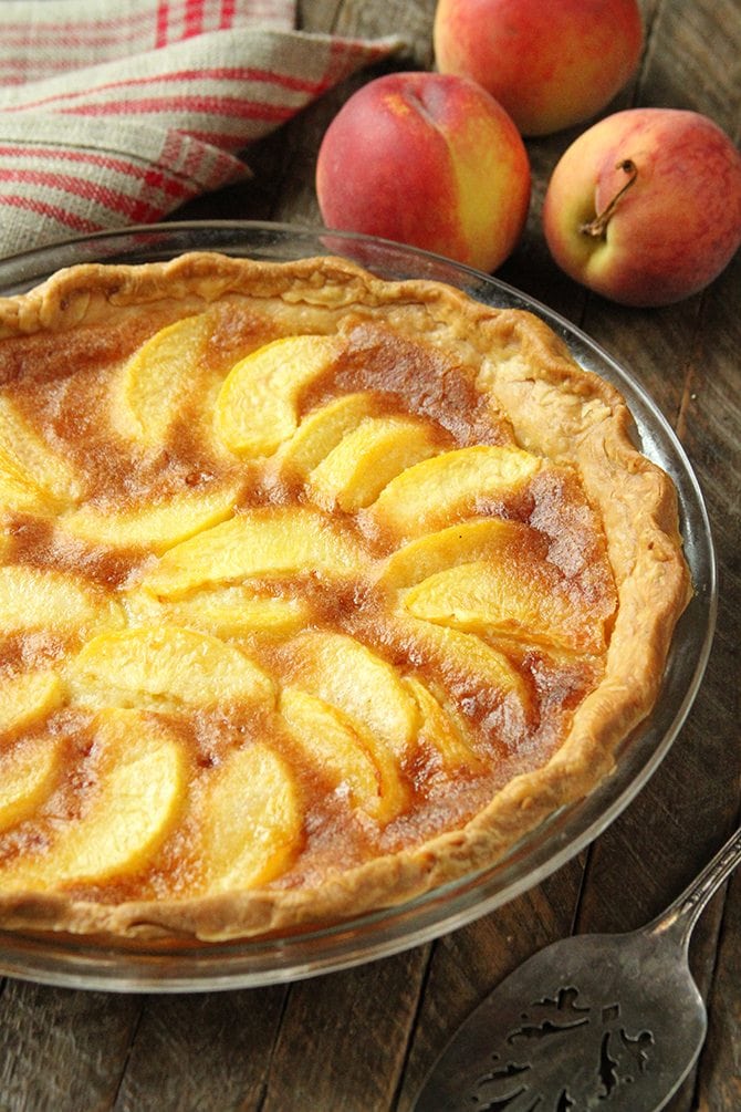 This Peach Chess Pie combines all the flavor of delicious peach cobbler in a decadent custard pie! 