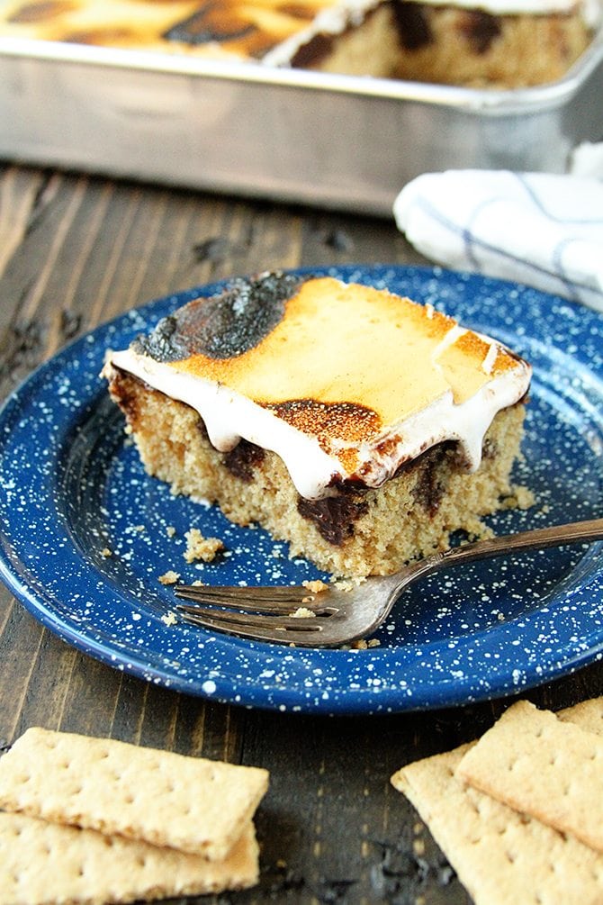 This S'mores Poke Cake recipe turns the campfire favorite into any anytime treat!