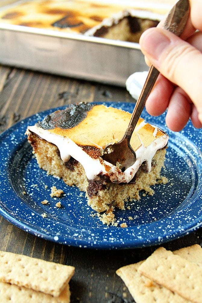 This S'mores Poke Cake recipe turns the campfire favorite into any anytime treat!