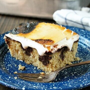 This S'mores Poke Cake recipe turns the campfire favorite into any anytime treat!