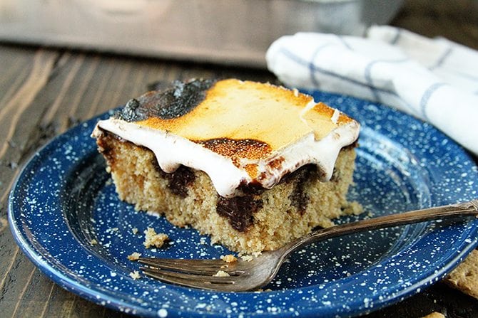 This S'mores Poke Cake recipe turns the campfire favorite into any anytime treat!