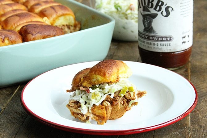 These BBQ Chicken Sliders with Dill Pickle Slaw are perfect for your next tailgate or a casual dinner with friends.  Plus they're made right in the slow cooker!