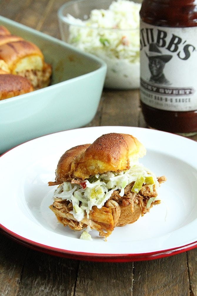 These BBQ Chicken Sliders with Dill Pickle Slaw are perfect for your next tailgate or a casual dinner with friends.  Plus they're made right in the slow cooker!