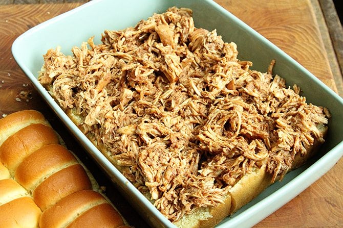 These BBQ Chicken Sliders with Dill Pickle Slaw are perfect for your next tailgate or a casual dinner with friends.  Plus they're made right in the slow cooker!