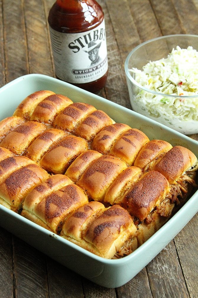 These BBQ Chicken Sliders with Dill Pickle Slaw are perfect for your next tailgate or a casual dinner with friends.  Plus they're made right in the slow cooker!