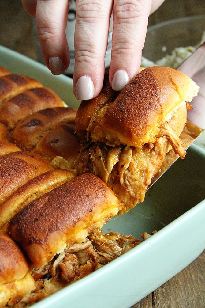 These BBQ Chicken Sliders with Dill Pickle Slaw are perfect for your next tailgate or a casual dinner with friends.  Plus they're made right in the slow cooker!