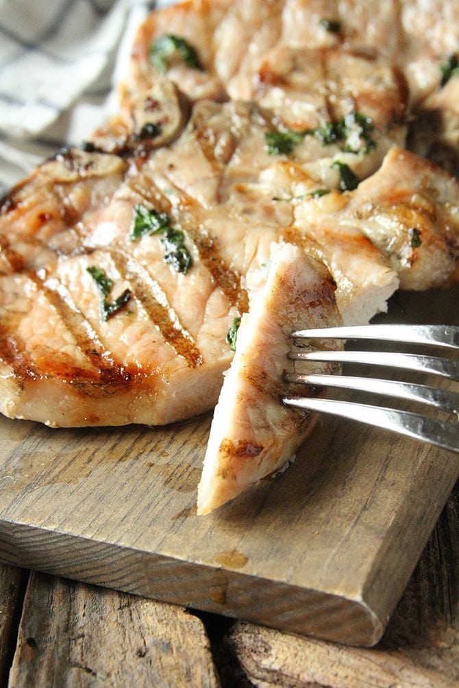 The easy brine on these Herb-Brined Pork Chops adds tons of flavor and keeps them tender and juicy!