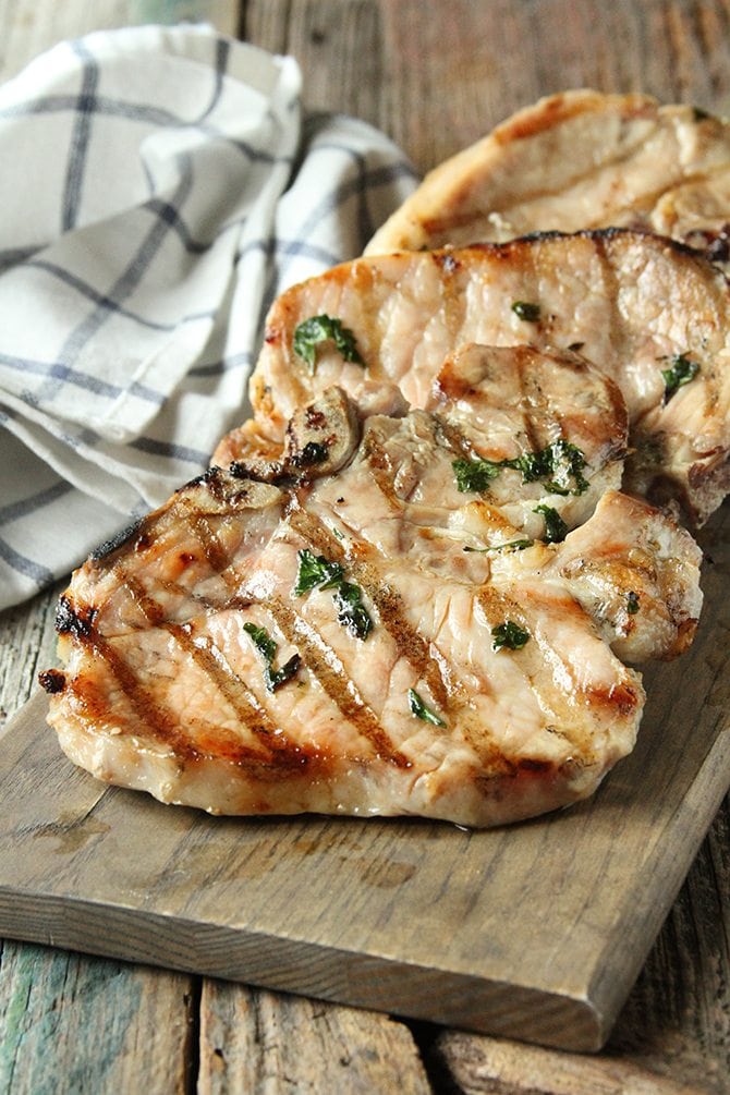 The easy brine on these Herb-Brined Pork Chops adds tons of flavor and keeps them tender and juicy!