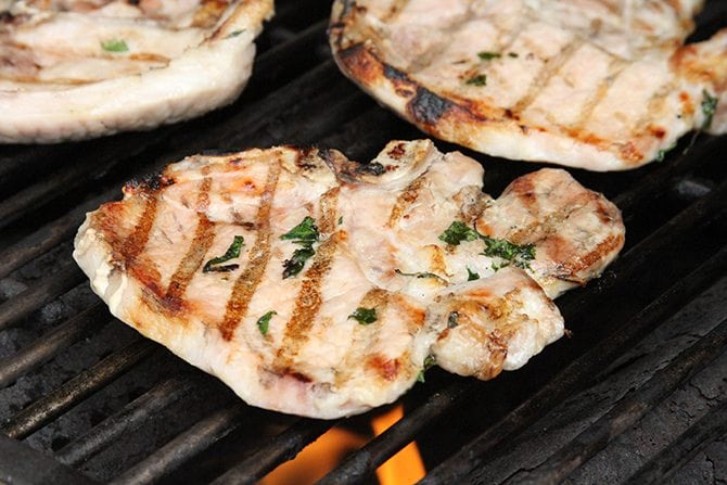 The easy brine on these Herb-Brined Pork Chops adds tons of flavor and keeps them tender and juicy!