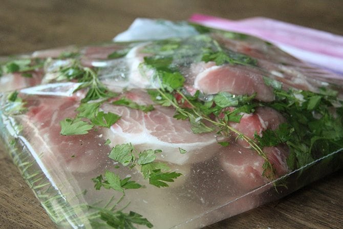 The easy brine on these Herb-Brined Pork Chops adds tons of flavor and keeps them tender and juicy!