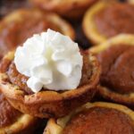 Cinnamon Roll Pumpkin Pie Bites with Whipped Cream.