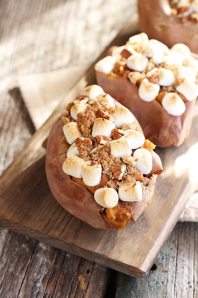 This Twice Baked Sweet Potato recipe combines the flesh of a sweet potato with butter, cream cheese, cinnamon, brown sugar, and pecans and tops them with marshmallows.