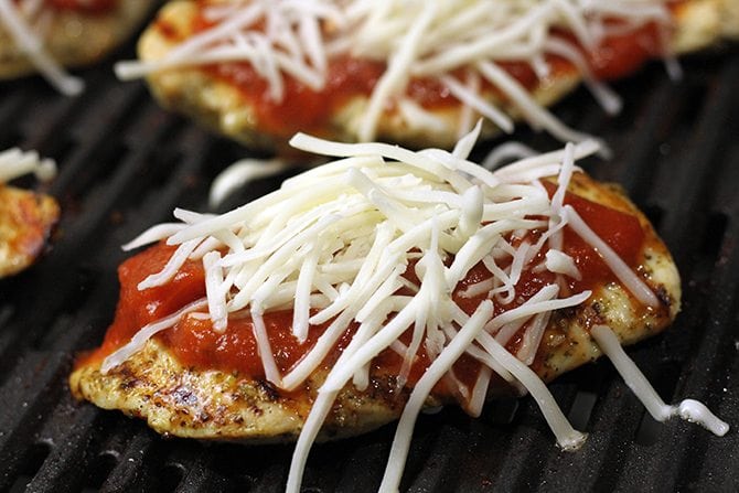 Six simple ingredients are all you need to make this jazzed up, lightened up Grilled Chicken Parmesan!  