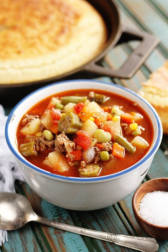 Vegetable Beef Soup with cornbread in background
