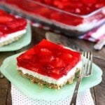 Servings of Strawberry Pretzel Salad on green serving dishes