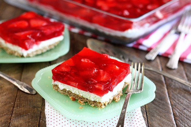 Servings of Strawberry Pretzel Salad on green serving dishes