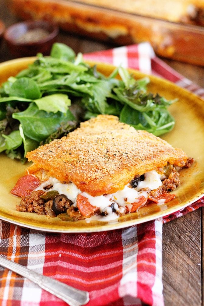 Upside Down Pizza Casserole being served with salad