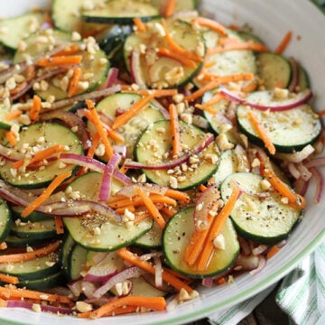 Garlic Soy Cucumber Salad on Stripped Towel.
