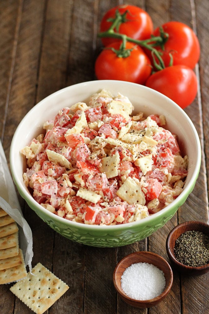Above photo of Tomato Cracker Salad with ingredients in background