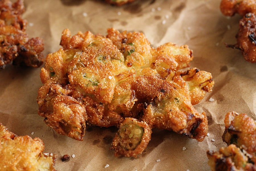 Okra and Green Tomatoes Fritters on brown parchment paper