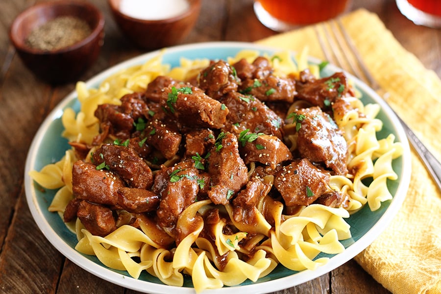 Slow Cooker Beef served over noodles