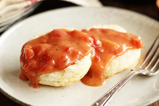 Close  photo of Biscuit covered in Southern Tomato Gravy