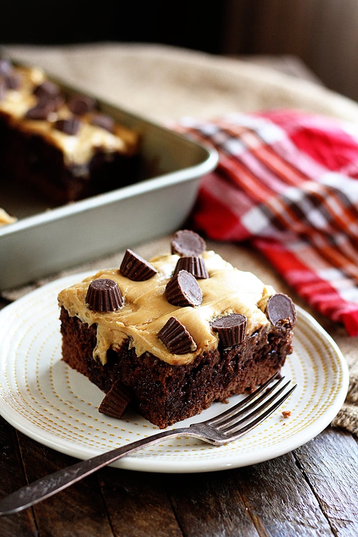 Piece of Chocolate Peanut Butter Poke Cake on plate.