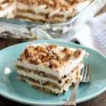 Slice of Milk and Cookies Icebox cake on green dish