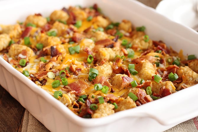 Bacon and Eggs Tater Tot Casserole in white baking dish