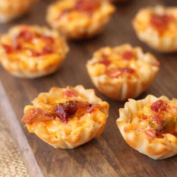 Close up photo of Pimento Cheese Bites on wooden serving board