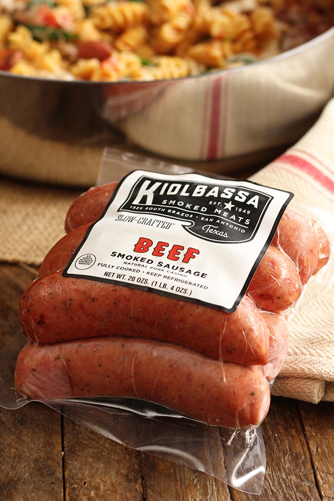 Simple One Pan Sausage Pasta in skillet with package of sausage in foreground