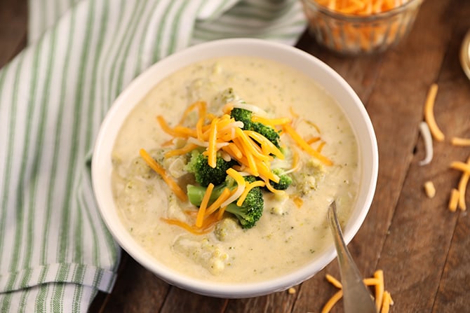 Top view of Broccoli and Cheese Soup with stripped towel